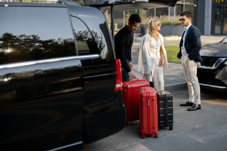 Chauffeur meeting a couple with luggage, Florence airport to train station transfer